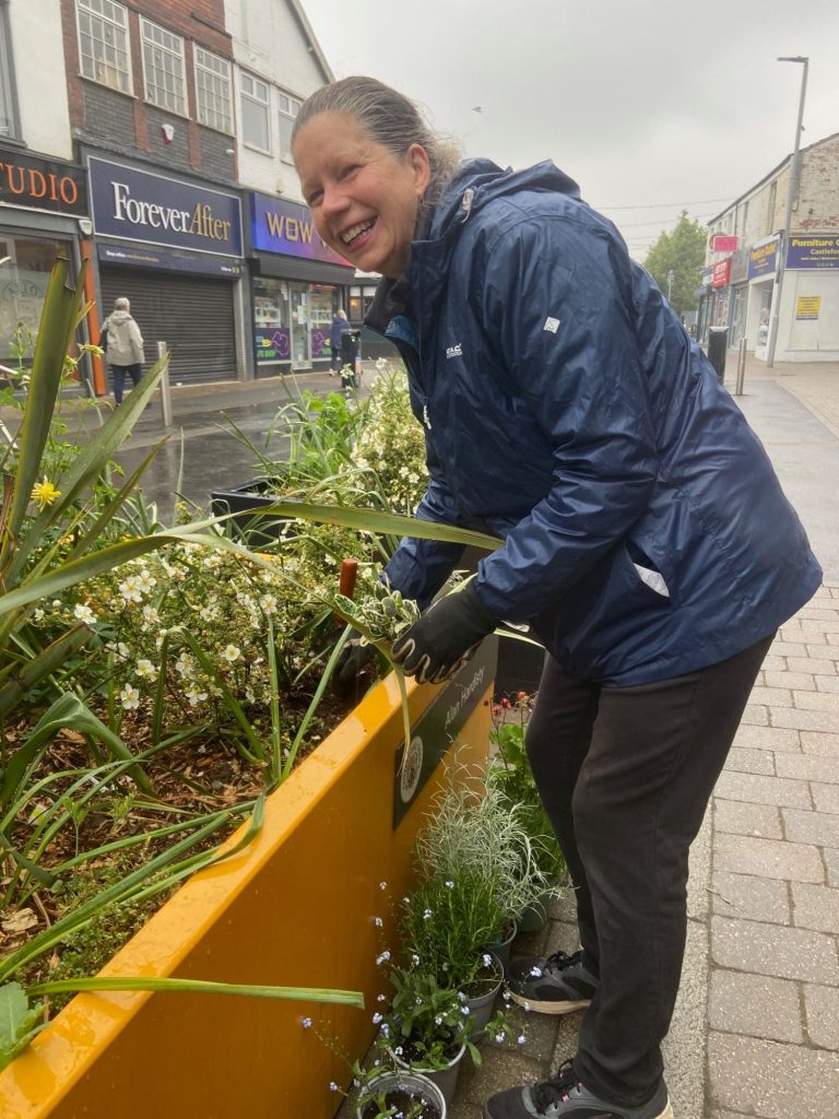 Blooming marvellous 
on this damp May Day the
Friends of Castleford library planting to brighten up the flower tubs outside the library.