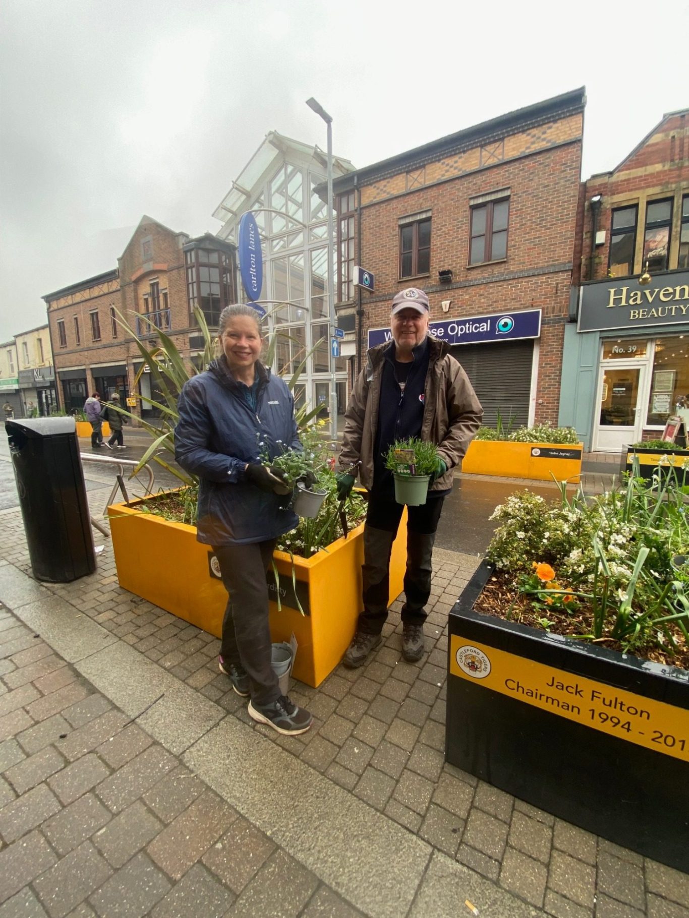 Blooming marvellous 
on this damp May Day the
Friends of Castleford library planting to brighten up the flower tubs outside the library.